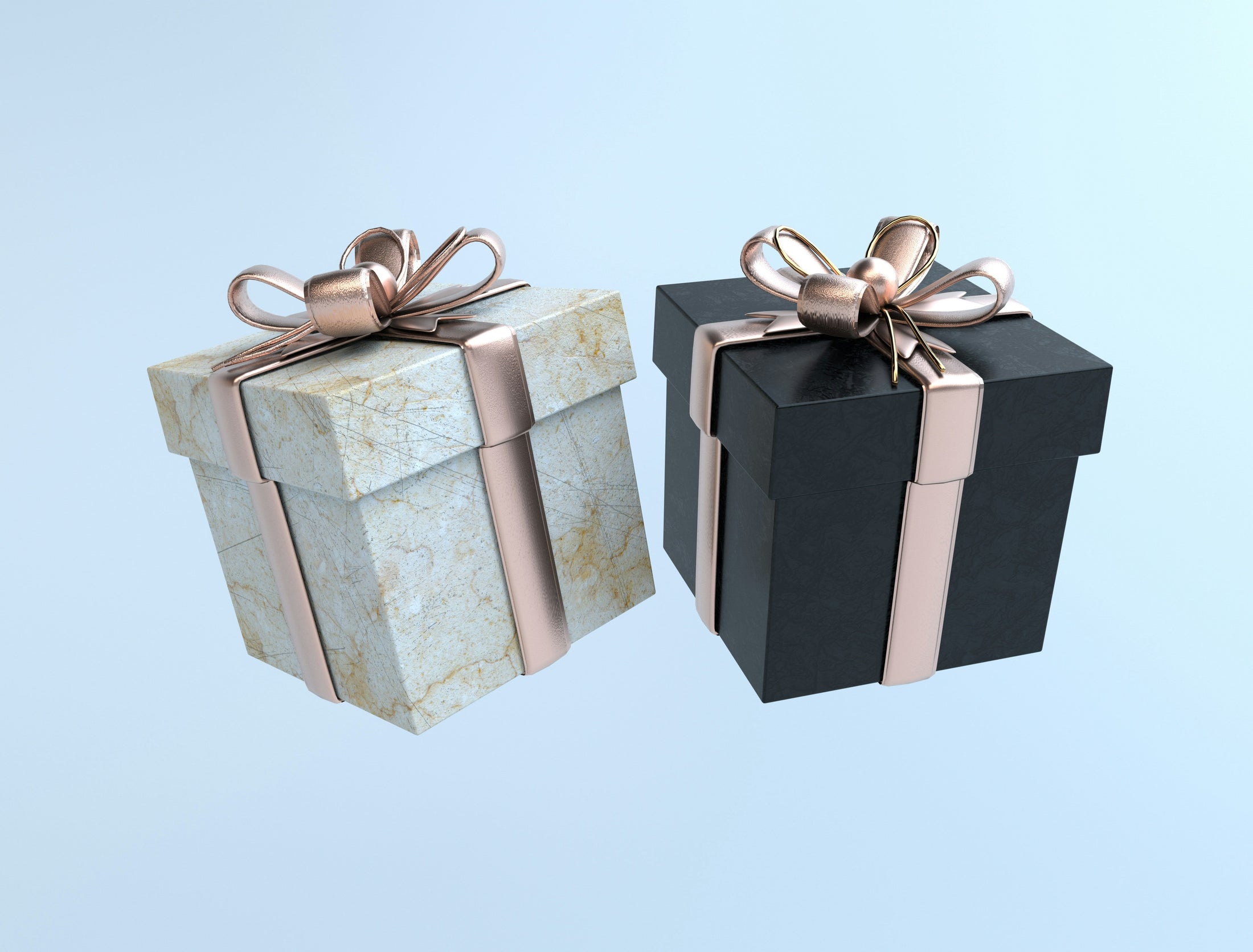 Two wrapped gift boxes in white marble and black with rose gold ribbons, a personalized holiday gift idea from Photo USA wholesale sublimation blanks