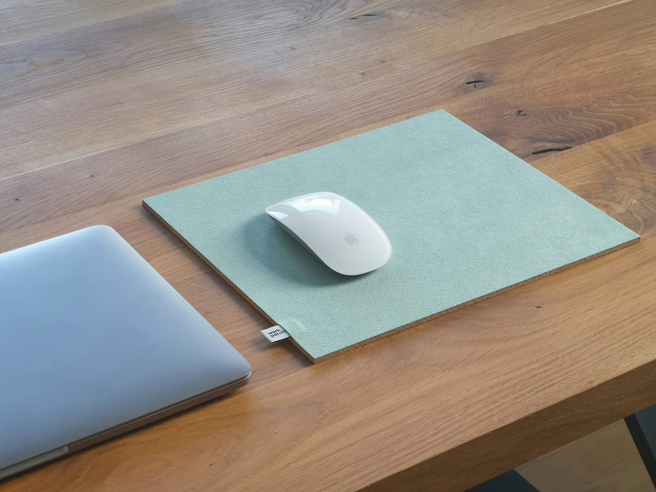 Sublimation mouse pad blank on a wooden desk with a laptop and mouse, wholesale mouse pad blanks by the case from Photo USA Corp.